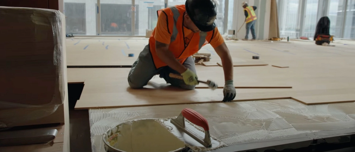 floor tradesman installing a floor